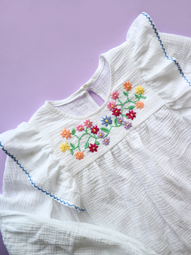 a white shirt with flower embrodiery