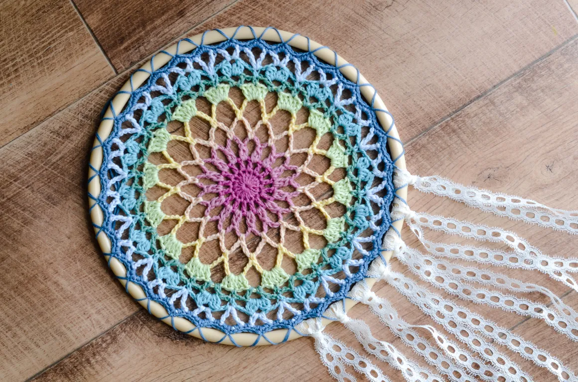 a multicolored crocheted dreamcatcher