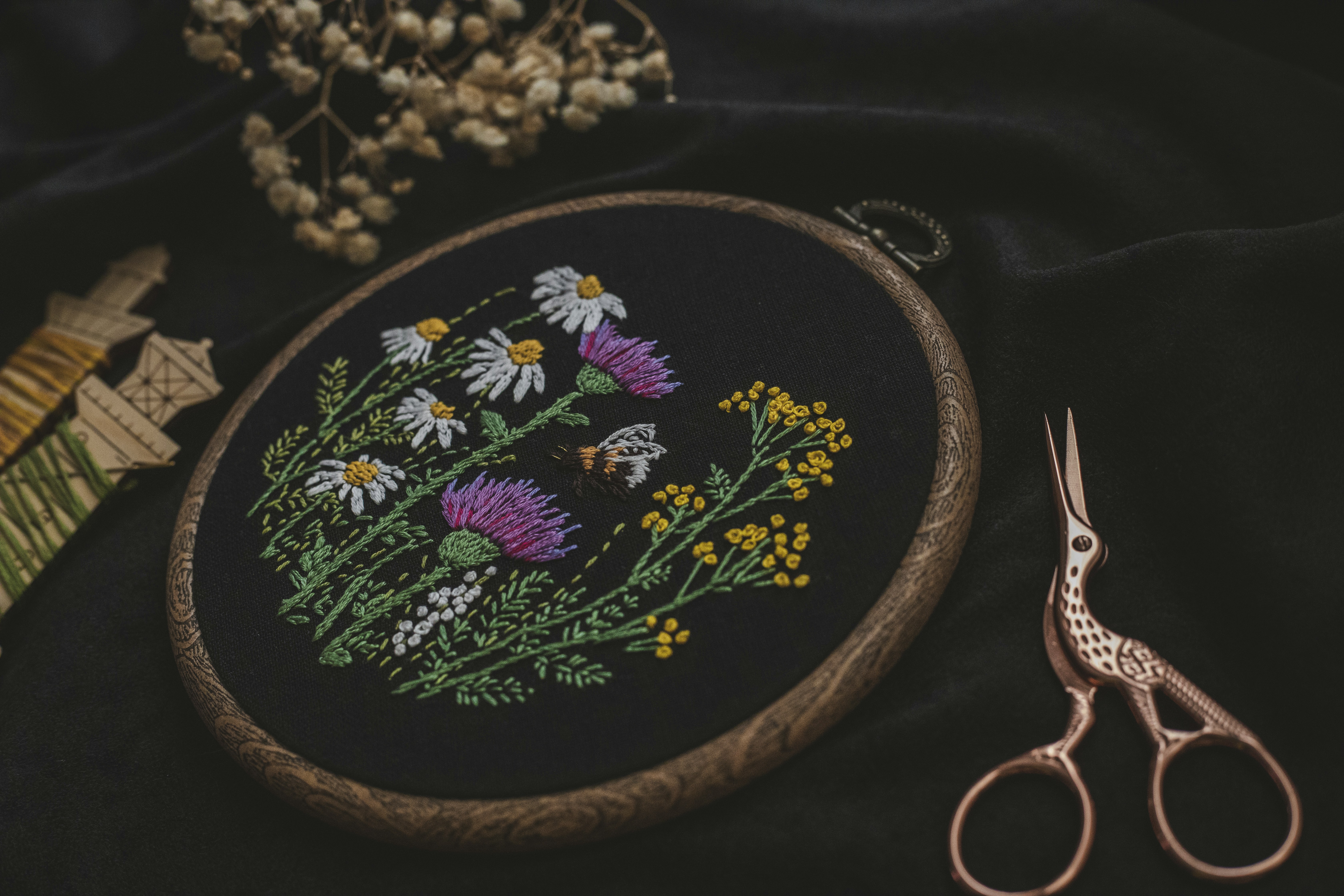 flowers on dark background of an embroidery hoop